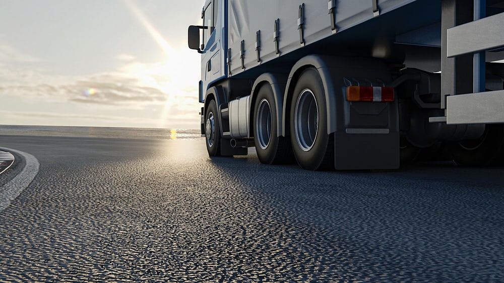 truck-is-driving-along-road-3d-image-3d-rendering